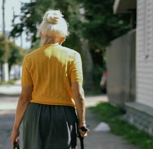 old woman with white hair from behind
